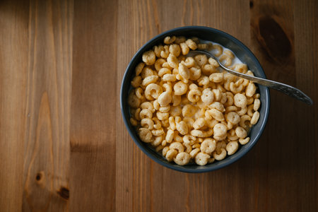 Bowl of Crunchy Breakfast Cereal with Spoonの写真素材