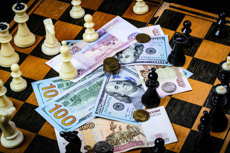 Chess and money on a dark backgroundの写真素材
