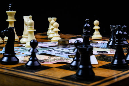 Chess and money on a dark backgroundの写真素材