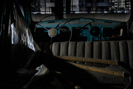 Old abandoned cars covered in dust and rust in the parking lotの写真素材