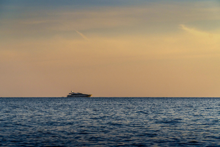 Sunset on a beautiful sky on a deserted seashoreの写真素材