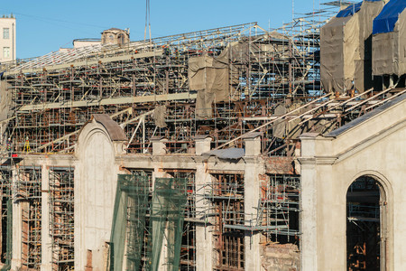 Construction in the center of Moscow. Cranes in the blue sky