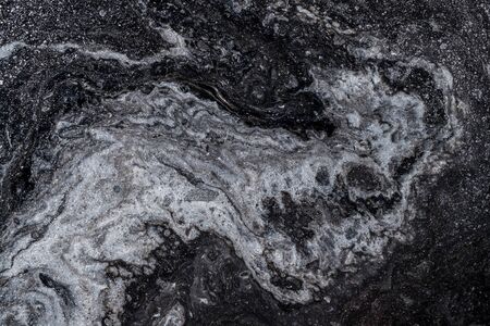 Abstract colored background from spilled paints closeup.の写真素材