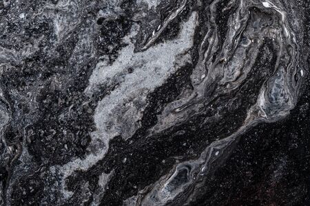 Abstract colored background from spilled paints closeup.の写真素材