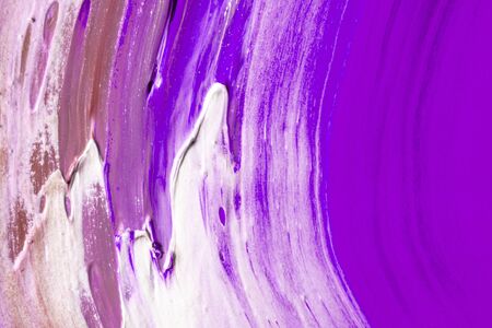 Abstract colored background from spilled paints closeupの写真素材