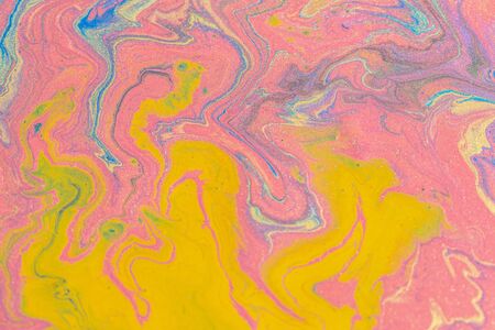 Abstract color background from liquid paints close-upの写真素材