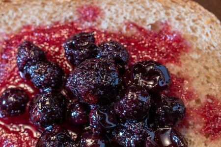 Freshly baked bread with blackcurrant berries and sugar.の写真素材