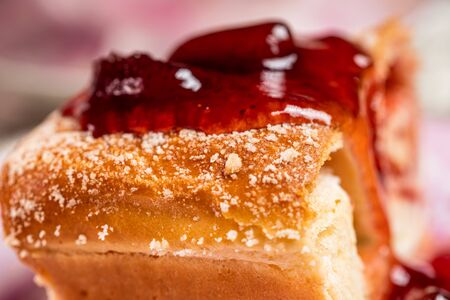 Strudel with strawberry jam and a cup of tea.の写真素材