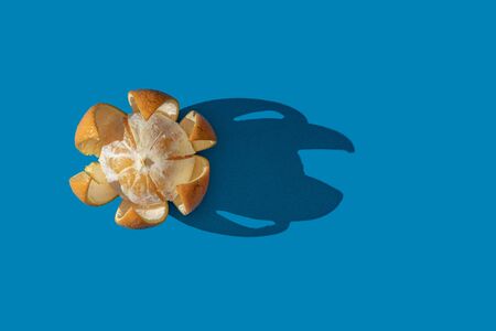 Oranges on a blue background. View from above.の写真素材