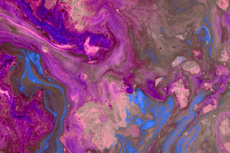 Abstract colored background of liquid mixed paints