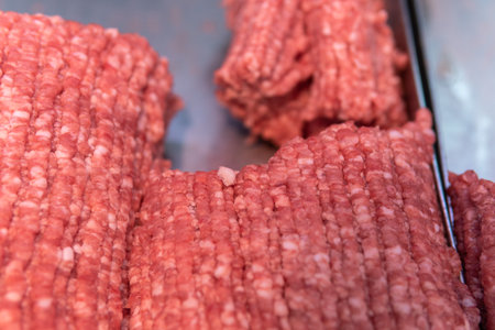 Fresh minced meat in a tray on the counter in a supermarketの写真素材