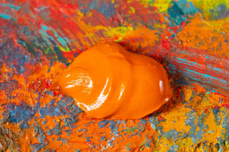 Artistic oil paints on palette close up.