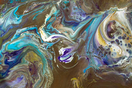 Multicolored paints create a beautiful abstract background.