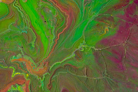 Multicolored paints create a beautiful abstract background.の写真素材
