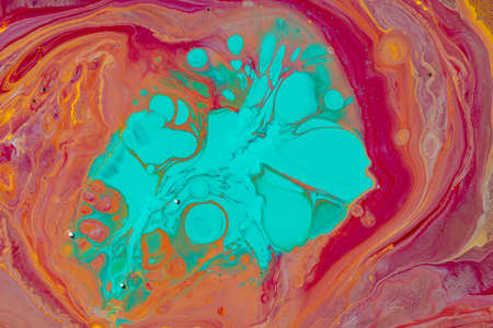 Multicolored paints create a beautiful abstract background.