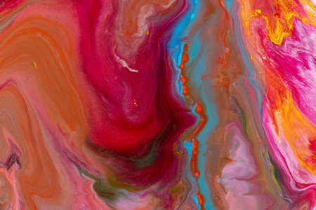 Multicolored paints create a beautiful abstract background.