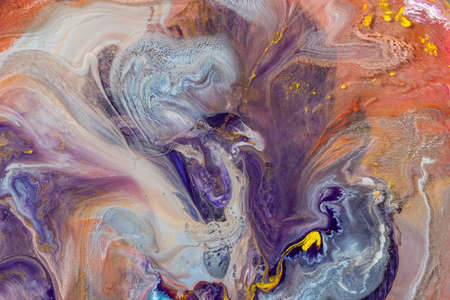 Multicolored paints create a beautiful abstract background.