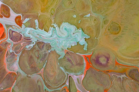 Multicolored paints create a beautiful abstract background.