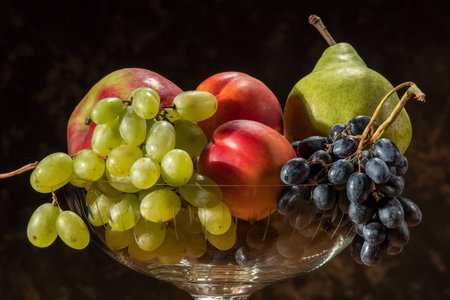 Still life with fruits. Grapes, nectarines, pears and plums.の写真素材