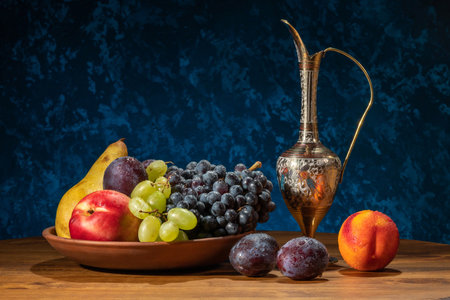 Still life with fruits. Grapes, nectarines, pears and plums.の写真素材