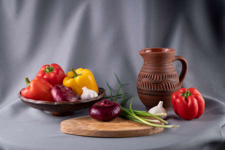 Still life with vegetables on a gray drapery background.の写真素材