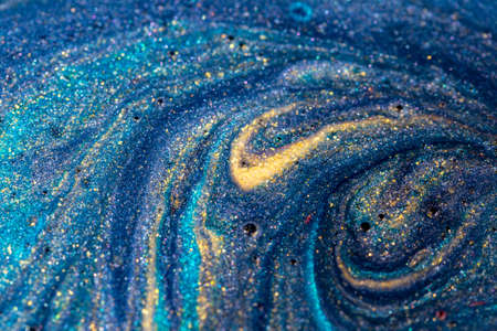 Abstract colorful background of mixed multicolored acrylic paints with sparklesの写真素材