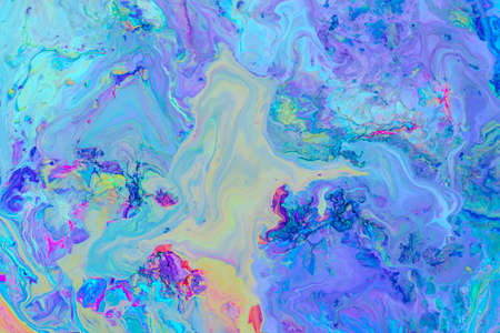 Abstract background from flowing colored liquid paints