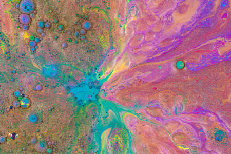 Abstract background from flowing colored liquid paints