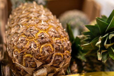 pineapples on the counter in the storeの写真素材