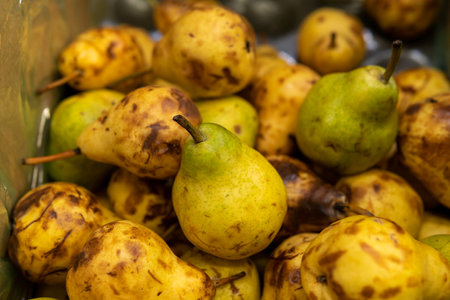 fresh pears on the counter in the supermarket