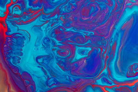 Abstract background from flowing colored liquid paints