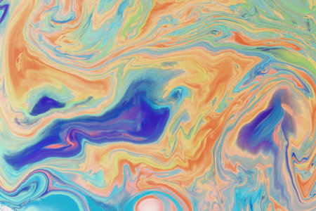Abstract background from flowing colored liquid paintsの写真素材