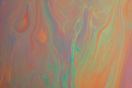 Abstract background from flowing colored liquid paints