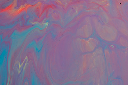 Abstract background from flowing colored liquid paints