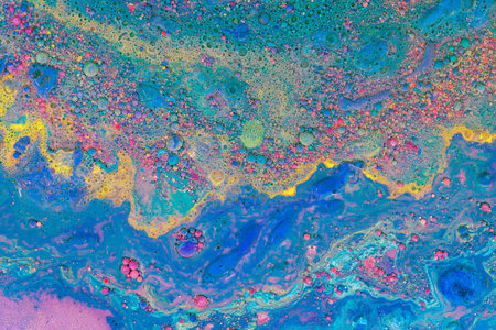 Multicolored paints create a beautiful abstract background