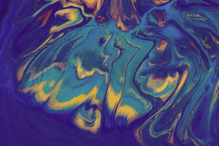 Multicolored paints create a beautiful abstract backgroundの写真素材