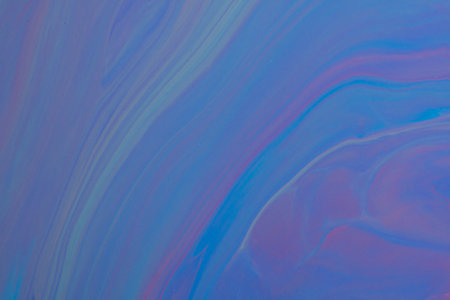 Abstract background from flowing colored liquid paints