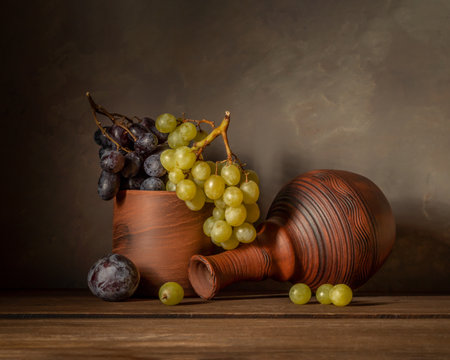 Still life with fruits in dark colors.の写真素材