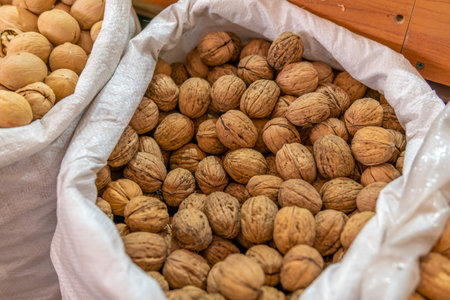 walnuts in a bag are sold at the market.の写真素材