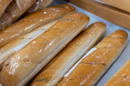 Bread wrapped in transparent film is sold in a supermarket.