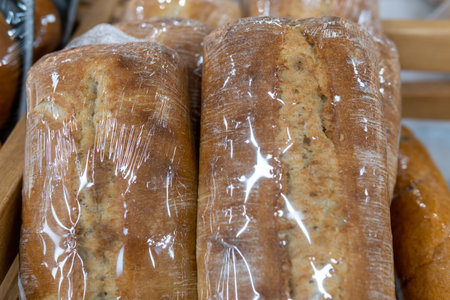 Bread wrapped in transparent film is sold in a supermarket.の写真素材