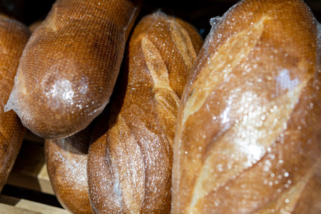 Bread wrapped in transparent film is sold in a supermarket.の写真素材