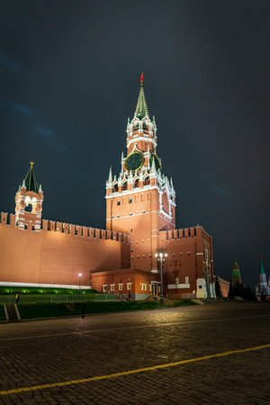 Night View Of Moscow Kremlin Spasskaya Tower Clock Over Red Brick Walls At Night