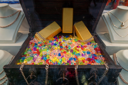 Treasure Chest Of Gold Bars And Colorful Gems Surrounded By Jewelry Displays.