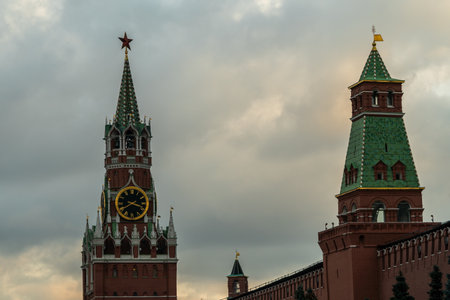 Iconic Kremlin Clock Tower and Spasskaya Tower on Red Square, Moscow at Sunset.の写真素材