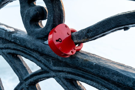 Rusted Padlock on Iron Railing Closeup With Frosted Winter Texture and Weathered Metal.