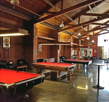 Billiard tables in a recreational room