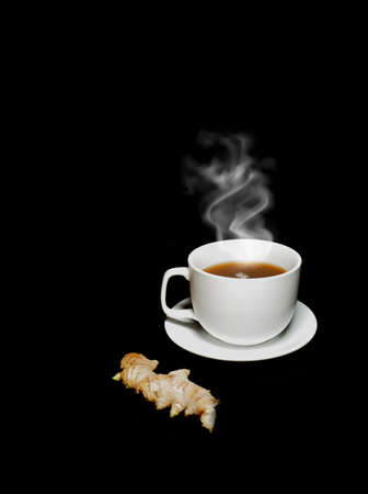 ginger and teacup on black backgroundの写真素材