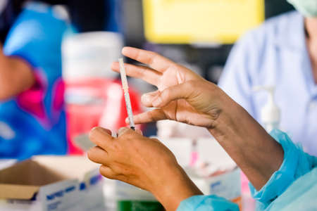 cropped image of the doctor making injection to a patient