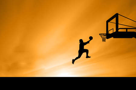 Silhouette image of a professional basketball player.の写真素材
